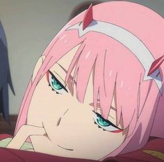 an anime character with pink hair and blue eyes