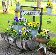 an old wagon filled with potted pansies and pansies