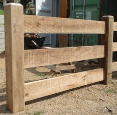 a wooden fence that has been made to look like it is being used as a planter