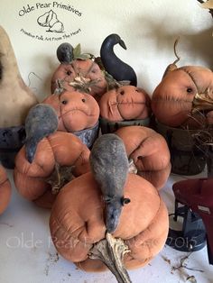 pumpkins and gourds are arranged on the table