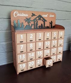 a wooden calendar sitting on top of a table