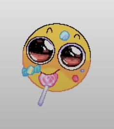 an emoticive smiley face holding a lollipop in it's mouth