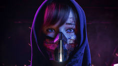 a woman with makeup painted on her face and hood over her head, holding a knife