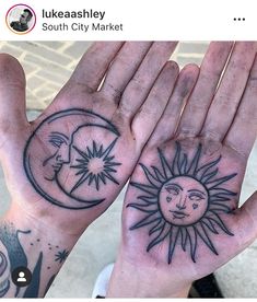 two hands with sun and moon tattoos on them