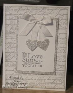 a white card with silver glitter hearts on it and the words'best love story is the one you want to be together '