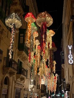 many lights hanging from the side of buildings