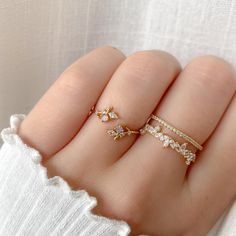 The Elna Ring is a whimsical leaf design, embellished with a sparkly pink crystal. Main material: Rose Gold, Rhodium, 16k Gold Plated on Brass, Cubic Zirconia Need some jewelry inspiration? Follow us on Instagram  @statementGrey Sparkling Crystal Open Ring Gift, Sparkling Open Crystal Ring Gift, Dainty Sparkling Rings As A Gift, Dainty Sparkling Rings As Gifts, Dainty Sparkling Rings For Gifts, Pink Open Ring Midi Rings For Wedding, Delicate Pink Open Ring Jewelry, Pink Crystal Ring With Sparkling Stones For Gift, Dainty Jewelry With Sparkling Stones For Promise Ring