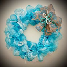 a blue and tan mesh wreath with a bow