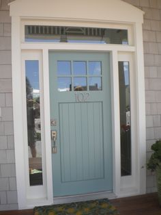 a blue front door with the number ten on it