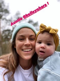 a woman holding a baby in her arms with the caption'aunte elekleychara '