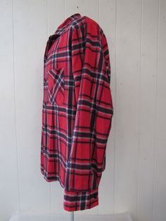 "Vintage 1960s shirt. Made of red, black and white plaid cotton flannel. Has two chest pockets, button front and button cuffs. Made by Sportswear. Size large. Actual measurements are: 43\" around the chest 43\" at the waist 18\" shoulder seam to shoulder seam 23.5\" shoulder seam to end of cuff 28.5\" overall length In very good condition with a 1/8\" rip at pocket corner - see picture." Vintage Flannel Shirt With Pockets, 1950s Shirts, Cheap Vintage Red Flannel Shirt, Red Vintage Flannel Shirt, Red Vintage Flannel Shirt With Button Closure, Vintage Flannel Button-up Shirt With Pockets, 1970s Dresses, Hawaiian Dress, White Plaid