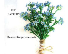 a bunch of blue flowers tied together with twine and burlock on white background