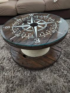 a coffee table with a compass design on it