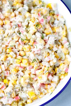 a bowl filled with corn salad on top of a table