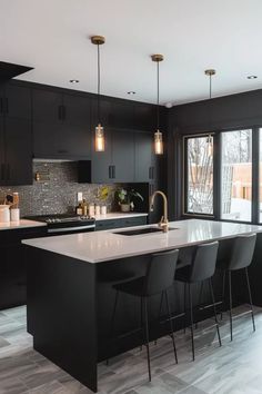 a kitchen with black cabinets and white counter tops, an island in the middle is surrounded by bar stools