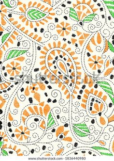 an orange and black paisley pattern on white fabric with green leaves, flowers and dots