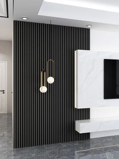 a modern living room with black and white striped walls, marble flooring and a flat screen tv mounted on the wall