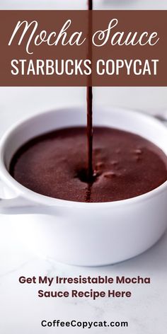 a white bowl filled with chocolate sauce on top of a table