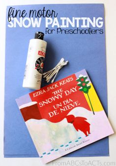 a snow painting for preschoolers is shown on top of a blue book with an eraser