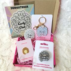 the suncather gift set includes two keychains, an earring and a card