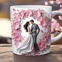 a coffee mug with a bride and groom in front of pink flowers on the side