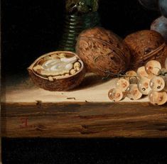 a painting of nuts and other food on a table