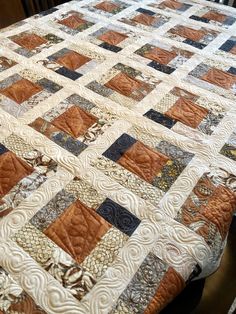 a quilted table topper on a dining room table