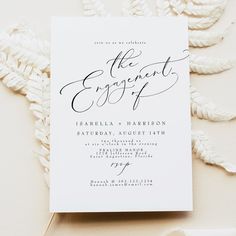 an elegant black and white wedding card with the word, the engagement suite on it