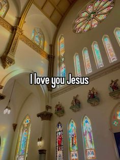 the words i love you jesus in front of stained glass windows