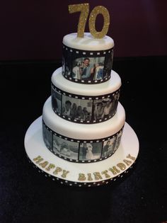 a birthday cake decorated with film strips and photos