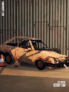 an old rusted out car sitting in front of a metal wall next to traffic cones