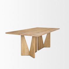 a wooden table sitting on top of a white wall