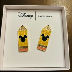 pair of disney character pencil earrings in box