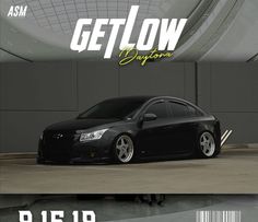 a black car parked in front of a building with the words getlow written on it