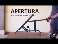 a man standing next to a metal object on top of a wooden floor with the words apertura en ambas posicones