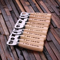 four bottle openers with words engraved on them