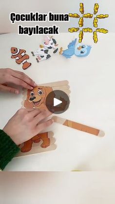 a person is making a paper dog puppet