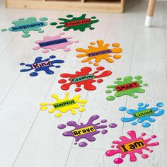 colorful stickers that say i am and have been placed on the floor