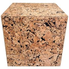 a brown and black granite block on a white background