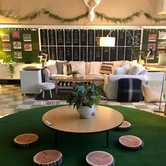 a living room filled with furniture and lots of green carpeted flooring on top of a checkered floor