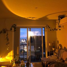 a living room filled with furniture and a sliding glass door that leads to a balcony