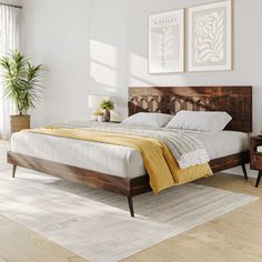 a bedroom with white walls and wooden furniture