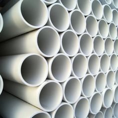 several white pipes stacked on top of each other