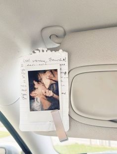 the back seat of a car with a photo pinned to it