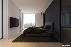 a bedroom with a large bed and a flat screen tv mounted on the wall above it