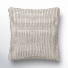 a white pillow on a gray background