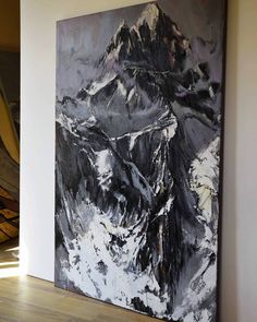 a large painting is hanging on the wall