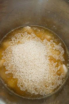 rice is being cooked in a pot on the stove