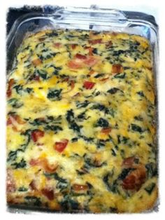 a casserole with tomatoes, spinach and cheese