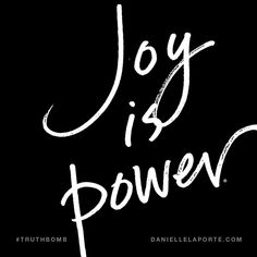 the words joy is power written in white ink on a black background with a handwritten inscription